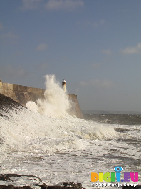 SX10162 Big wave onto lighthouse on harbour wall at Porthcawl point